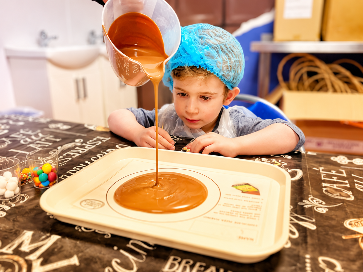 We made chocolate pizzas at Inspired Chocolate in Yorkshire, and Cyrus loved every messy minute